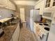 Functional kitchen with ample counter space, white appliances, and convenient storage at 510 Cranes Way # 105, Altamonte Springs, FL 32701