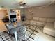 Inviting living area with comfortable seating, a dining table, and a view of the kitchen at 510 Cranes Way # 105, Altamonte Springs, FL 32701