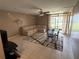 Relaxing living room featuring a plush sectional sofa, dining table, and ceiling fan at 510 Cranes Way # 105, Altamonte Springs, FL 32701