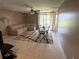 Cozy living room with neutral tones, comfortable seating, and bright natural light at 510 Cranes Way # 105, Altamonte Springs, FL 32701