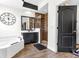 Modern bathroom with a walk-in shower, soaking tub, and dark accents at 572 Lanarkshire Pl, Apopka, FL 32712