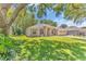Well-kept lawn and vibrant landscaping surround a charming home with an attached two-car garage at 572 Lanarkshire Pl, Apopka, FL 32712