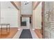 Spacious foyer with wood and tile flooring leading to a living area with ample natural light at 572 Lanarkshire Pl, Apopka, FL 32712