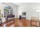 Sunlit room with hardwood floors, a large window, and ample space for furnishings and decor at 572 Lanarkshire Pl, Apopka, FL 32712