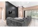 Open living area with a plush sofa, a ceiling fan, and sliding doors to the outdoors at 572 Lanarkshire Pl, Apopka, FL 32712