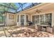 Large, screened patio with a ceiling fan, grill, and outdoor seating at 572 Lanarkshire Pl, Apopka, FL 32712