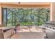 Spacious screened patio with outdoor furniture and a beautiful backyard view at 572 Lanarkshire Pl, Apopka, FL 32712