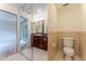 Bathroom featuring a vanity, toilet and mirror leading to the exterior at 604 Blue Lake Dr, Longwood, FL 32779