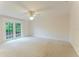 The bedroom has french doors leading to the exterior; a ceiling fan adds comfort at 604 Blue Lake Dr, Longwood, FL 32779
