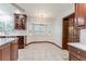 Bright eat-in kitchen with large window and breakfast nook with chandelier at 604 Blue Lake Dr, Longwood, FL 32779