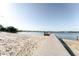 Picturesque lakeside dock and sandy beach, perfect for swimming and boating at 604 Blue Lake Dr, Longwood, FL 32779
