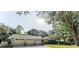 Charming home with a three-car garage and well-maintained landscaping at 604 Blue Lake Dr, Longwood, FL 32779