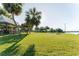 Scenic park with lush green space, picnic tables, shelter and palm trees in a serene outdoor setting at 604 Blue Lake Dr, Longwood, FL 32779