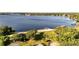 Aerial shot highlighting the park's playground, beach, and boat dock along the tranquil lake at 604 Blue Lake Dr, Longwood, FL 32779
