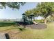 Community playground with modern play equipment and a safe rubber surface at 604 Blue Lake Dr, Longwood, FL 32779