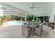 An inviting screened-in pool area is furnished with comfortable seating and dining options at 604 Blue Lake Dr, Longwood, FL 32779
