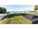 Community park offering a volleyball court, swings, and picnic tables by the lake at 604 Blue Lake Dr, Longwood, FL 32779