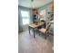 Bright office space with a wooden desk, stylish decor, and ample natural light at 6450 Horseshoe Lane Way, St Cloud, FL 34773