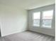 Bright, airy bedroom with two large windows offering plenty of natural light at 6458 Horseshoe Lane Way, St Cloud, FL 34773
