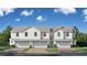 Inviting new construction townhomes boast a light gray facade, two-car garages and manicured landscaping at 6458 Horseshoe Lane Way, St Cloud, FL 34773