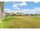 Expansive backyard features lush lawn with a fence, providing ample space for outdoor activities at 660 Egret Place Dr, Winter Garden, FL 34787