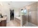 Spacious bathroom featuring a soaking tub, separate shower, and vanity with granite countertops at 660 Egret Place Dr, Winter Garden, FL 34787
