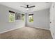 Minimalist bedroom design with three bright windows allowing natural light to flood the room at 660 Egret Place Dr, Winter Garden, FL 34787