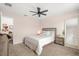 Simple bedroom with a large window providing natural light, complemented by modern furnishings at 660 Egret Place Dr, Winter Garden, FL 34787