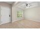 Bright entryway featuring tile and wood floors, with a ceiling fan and a large window, offering a welcoming space at 660 Egret Place Dr, Winter Garden, FL 34787