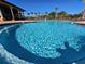 A sparkling community swimming pool with inviting lounge chairs, perfect for relaxation and recreation at 660 Egret Place Dr, Winter Garden, FL 34787
