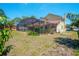 Spacious backyard featuring a screened-in pool and patio area, perfect for outdoor relaxation and entertainment at 6630 Abeydon Ct, Orlando, FL 32818