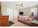 Cozy bedroom with wood trim and flooring with closet and window features at 6630 Abeydon Ct, Orlando, FL 32818