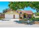 Charming two-story home features a brick-accented facade and a spacious two-car garage at 6630 Abeydon Ct, Orlando, FL 32818
