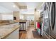 Open kitchen design with stainless steel appliances and granite countertops at 6630 Abeydon Ct, Orlando, FL 32818