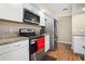 Contemporary kitchen featuring stainless steel appliances and granite countertops at 6630 Abeydon Ct, Orlando, FL 32818