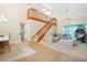 Bright and open living room features vaulted ceilings, a staircase, and comfortable seating area at 6630 Abeydon Ct, Orlando, FL 32818
