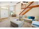 Bright and open living room features vaulted ceilings, a staircase, and comfortable seating area at 6630 Abeydon Ct, Orlando, FL 32818