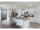 Bright kitchen featuring stainless steel appliances, granite countertops, and a central island at 7155 Cow Prairie Rd, St Cloud, FL 34773