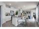 Modern kitchen with stainless steel appliances, granite countertops, and a stylish center island at 7155 Cow Prairie Rd, St Cloud, FL 34773