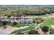 Aerial view of homes overlooking the lush green golf course at 7388 Gathering Ct, Reunion, FL 34747