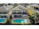 Stunning aerial view of a luxury home showcasing a private pool, spa, and outdoor living spaces at 7388 Gathering Ct, Reunion, FL 34747