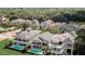 A premier golf course community contains lush mature trees and well manicured lawns at 7388 Gathering Ct, Reunion, FL 34747
