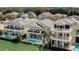 Beautiful backyard pools are complimented by tropical landscaping in a premier golf community at 7388 Gathering Ct, Reunion, FL 34747