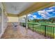 Spacious covered balcony with views of the golf course provides a relaxing outdoor retreat at 7388 Gathering Ct, Reunion, FL 34747