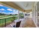 Spacious balcony overlooking a serene golf course, perfect for relaxation and outdoor dining at 7388 Gathering Ct, Reunion, FL 34747