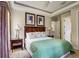 Bedroom with trey ceilings, natural light, and bedside table at 7388 Gathering Ct, Reunion, FL 34747