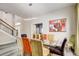 Bright dining room features modern lighting, contemporary art, and stylish seating for a contemporary dining experience at 7388 Gathering Ct, Reunion, FL 34747