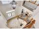 Bright two-story foyer with view to staircase, decorative lighting, and front door at 7388 Gathering Ct, Reunion, FL 34747