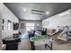 Recreation room with air hockey, foosball table, theater seating and mini-basketball at 7388 Gathering Ct, Reunion, FL 34747