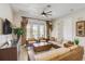 Living room with hardwood floors, modern furniture and ample natural light at 7388 Gathering Ct, Reunion, FL 34747
